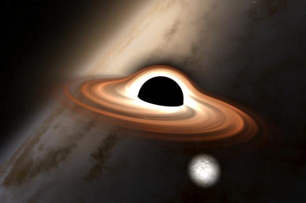 

Astronomové poprvé sledovali světlo zpoza černé díry. Je to další důkaz, že měl Einstein pravdu

